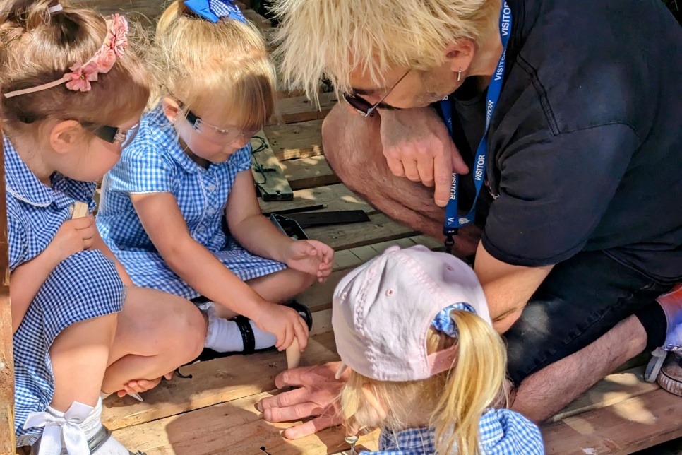 Three pre-school children with their Creative Practitioner, Stuart Bawler at Sunshines Pre-school